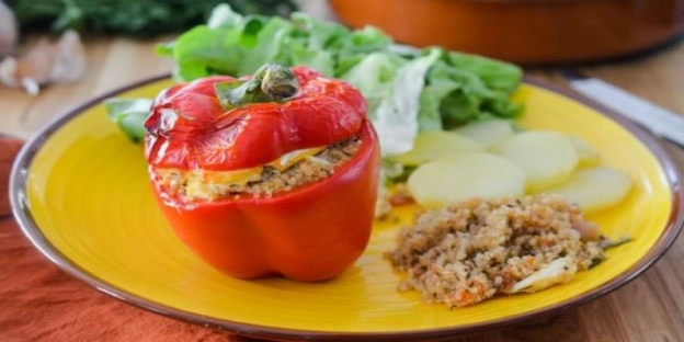 A stuffed pepper on a plate AI-generated content may be incorrect.